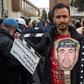 Supporters of Morocco's al-Hirak al-Shaabi movement hold placards and shout slogans calling for the release of the movement's members outside the Casablanca Court of Appeals during their trial on April 5, 2019