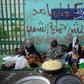 Sudanese women prepare food to be served during the Iftar (breaking of the fast) at sunset during the Muslim holy month of Ramadan, as they protest outside the army headquarters in the capital Khartoum