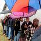 People queue to vote for South Africa's national and provincial elections at a polling station in the Tlhabologang township in Coligny