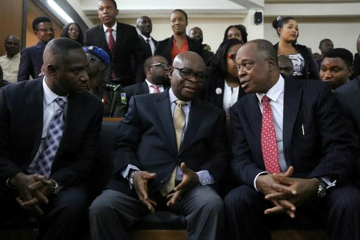 Nigeria's Chief Justice Walter Onnoghen (C, pictured February 2019) was charged with failing to declare foreign currency bank accounts, in contravention of rules governing declaration of assets for public officials