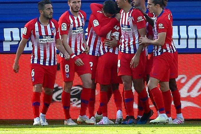 Atletico Madrid's players celebrate Thomas Lemar's winner against Eibar on Saturday.