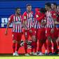 Atletico Madrid's players celebrate Thomas Lemar's winner against Eibar on Saturday.
