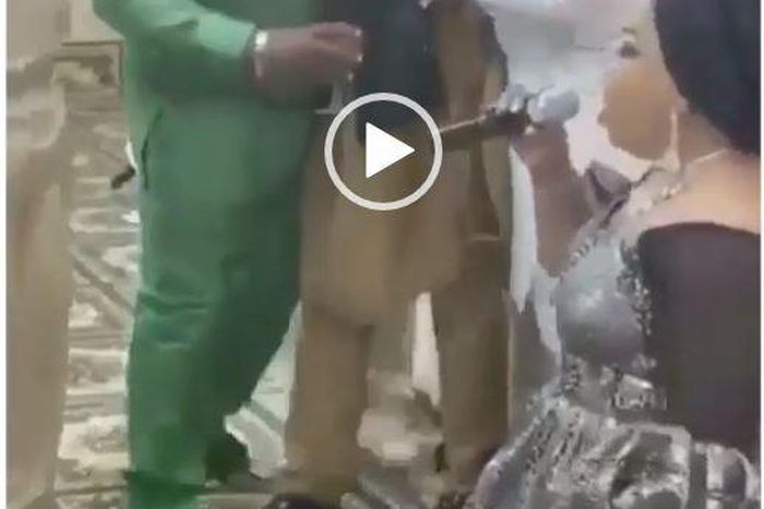 Man cries profusely as wife kneels down and showers praises on him at public event (Video)