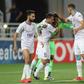 Al Ain players mob goalkeeper Khalid Eisa after his heroics allowed them to snatch a draw in Qatar