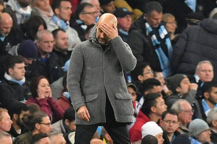 Hurting: Manchester City manager Pep Guardiola