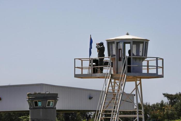 UN peacekeepers observe the Quneitra border crossing with Syria in the Israeli annexed-Golan Heights