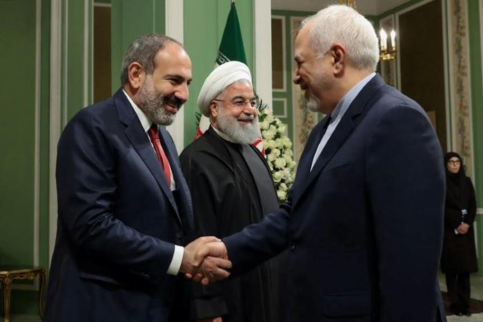 Iranian Foreign Minister Mohammad Javad Zarif welcomes Armenian Prime Minister Nikol Pashinyan to Tehran in front of a smiling President Hassan Rouhani who rejected his top diplomat's resignation