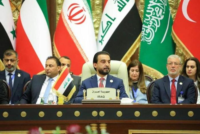 A handout picture released by the Iraqi parliament's press office on April 20, 2019 shows Speaker Mohammed al-Halbusi presiding over a conference with peers from neighbouring countries' legislatures