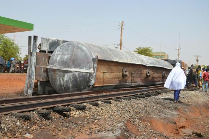 The tanker truck tipped over and exploded after crowds tried to collect spilt fuel