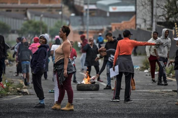 Johannesburg residents burn tyres on April 23, 2019 to protest the allocation of council services