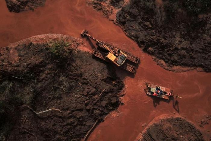 Aerial view of emergency crews picking through the mud looking for bodies, 99 days after the collapse of a tailings dam January 25, 2019 in Brazil's Minas Gerais state; at least 242 people were killed in the disaster