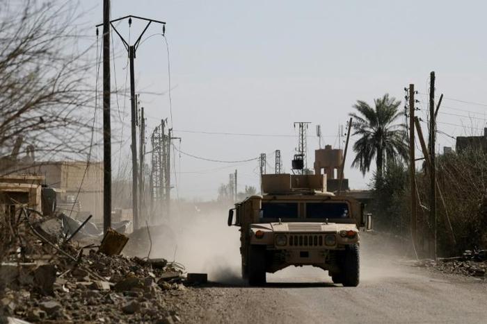 An armoured vehicle belonging to the US-backed Syrian Democratic Forces (SDF) near the front line village of Baghouz in eastern Syria on February 2, 2019