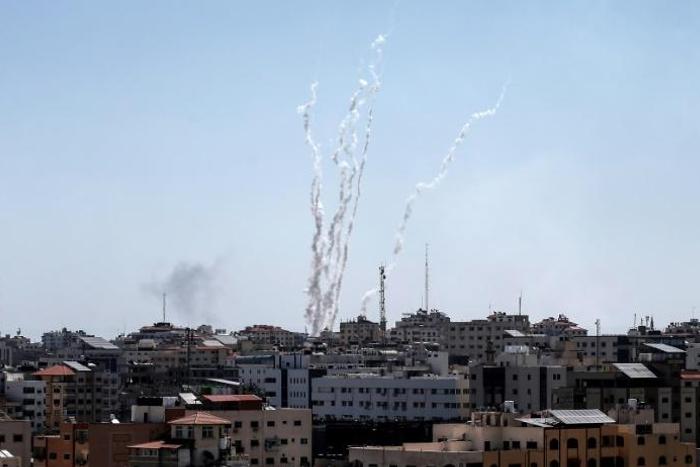 Palestinian militants in Gaza fire a barrage of rockets at Israel, prompting retaliatory air strikes as a fragile ceasefire again falters