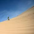 Sun-kissed and shaggy haired, Nguyen Thai Binh swaps his flip flops for bulky boots ahead of snowboarding practice on the sand dunes of southern Vietnam -- the unlikely training ground for the country's fledgling winter athletes