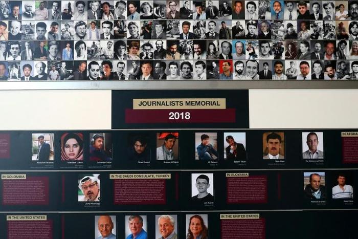 Pictures and names of journalists who were killed in 2018 while doing their job, are on display during the annual Journalist Memorial rededication ceremony at the Newseum on June 3, 2019