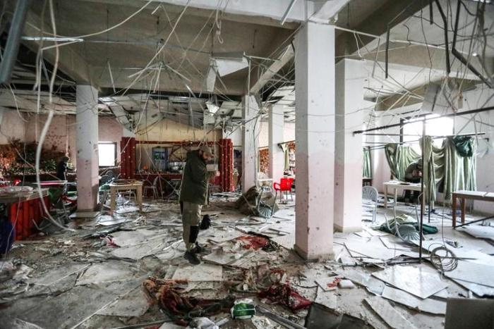 A man inspects the remains of a restaurant after a reported suicide attack in the rebel-held northern Syrian city of Idlib on March 1, 2019