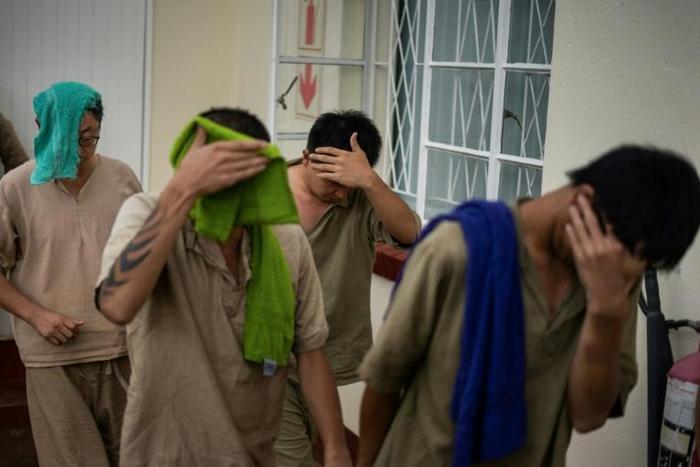 A magistrate in the northern resort town of Hwange dismissed an application by the seven unemployed Chinese nationals (pictured January 2019, leaving the Victoria Falls magistrate court) to have the charges thrown out