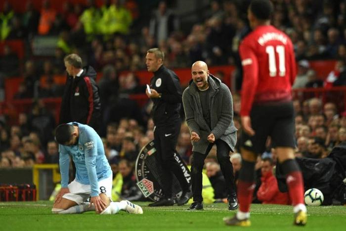 Victory charge: Manchester City manager Pep Guardiola celebrates