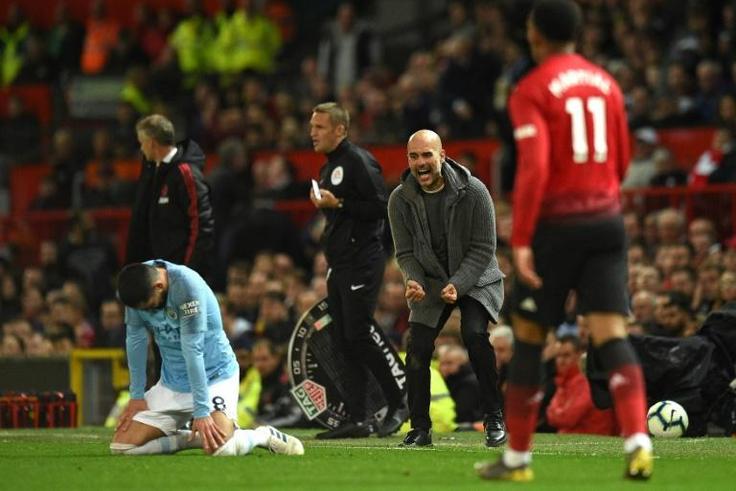 Victory charge: Manchester City manager Pep Guardiola celebrates