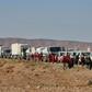 An aid convoy of the Red Crescent arrives at the Rukban desert camp for displaced Syrians along Syria's border with Jordan on February 06, 2019