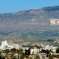 The Kyrenia mountain range, in the north of Cyprus, daubed with the Turkish flag and a quote by Turkey's late founder Ataturk, overlooks the island's divided capital of Nicosia, and can be plainly seen on the Greek Cypriot side