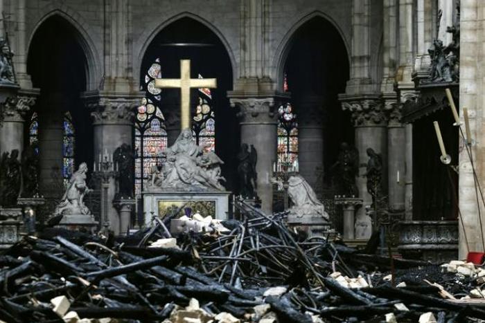 Charred debris in front of the altar at Notre-Dame cathedral in Paris in the aftermath of a devastating blaze which destroyed the monument's roof