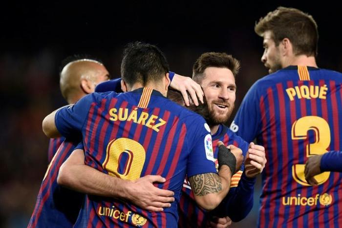 Lionel Messi and his Barcelona teammates celebrate. They have won La Liga for the fourth time in five seasons