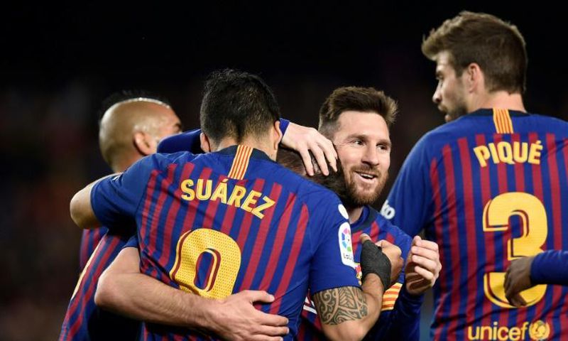 Lionel Messi and his Barcelona teammates celebrate. They have won La Liga for the fourth time in five seasons