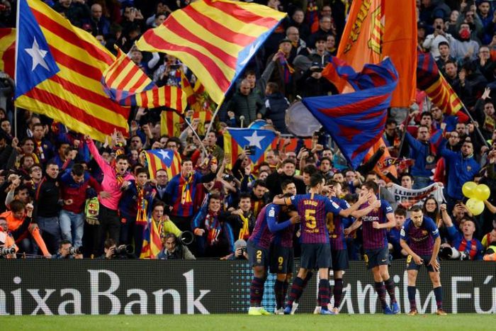 Barcelona players celebrate their fourth goal during the Spanish league match between FC Barcelona and Real Madrid CF at the Camp Nou stadium in Barcelona on October 28, 2018