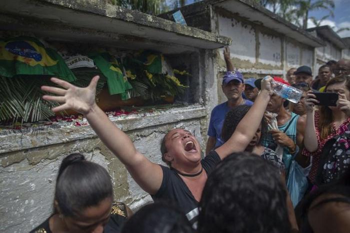 A relative reacts during the funeral of Brazilian musician Evaldo dos Santos Rosa, who was killed by an army unit when it shot at his car by mistake