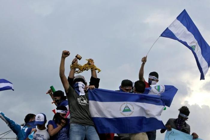 Anti-government demonstrators stage a protest on May 26, 2018 demanding Nicaraguan President Daniel Ortega and his wife, Vice President Rosario Murillo, to stand down, in Managua