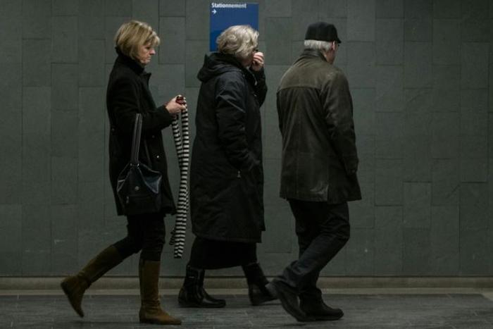 Alexandre Bissonnette's parents, Manon Marchand (L) and Raymond Bissonnette, exit Quebec City courthouse after hearing the sentence for their son on February 8, 2019