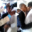 Wedding guests make unexcited groom and bride kiss by force (video)