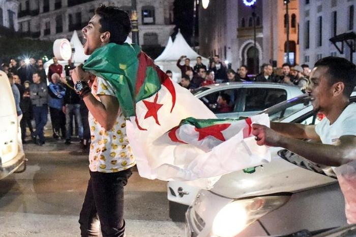 Celebratory honking of car horns ran out in the centre of Algiers, after President Abdelaziz Bouteflika announced he would not seek re-election