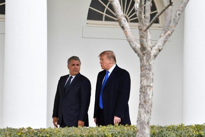 US President Donald Trump (R) greets Colombian President Ivan Duque at the White House on February 13, 2019