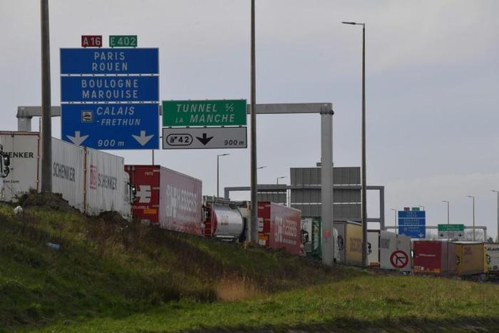 The men arrived at the Calais entrance to the Channel Tunnel linking France to England in a van filled with coffins, one of which contained an Iraqi migrant