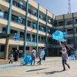 Palestinian girls fly kites in the courtyard of an UNRWA-run school in Gaza during a protest against US aid cuts that threatened their education until other donors stepped in