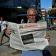 File photo of a man reading Cuban daily Granma in a Havana street, on May 19, 2018
