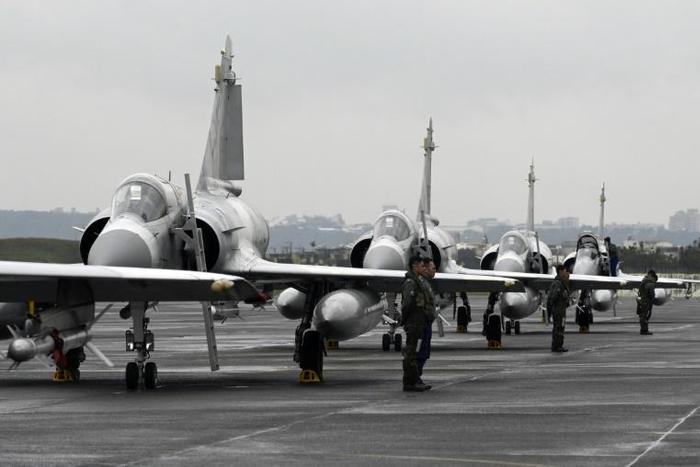 Taiwan air force pilots stand next to French-made Mirage fighter jets during an annual exercise at the Hsinchu base in January