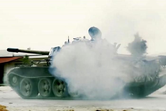 This grab obtained from a video published on the Libyan strongman Khalifa Haftar's self-proclaimed Libyan National Army (LNA) War Information Division's Facebook page on April 24, 2019, shows smoke around a tank reportedly during clashes with forces lo...