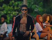 Kuami Eugene on set with girls