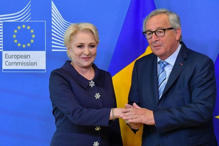 Romania's Prime Minister Viorica Dancila (L) is welcomed by European Commission President Jean-Claude Juncker at the European Commission in Brussels on June 4, 2019
