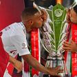 Qatar's players kiss the trophy as they celebrate their win during the 2019 AFC Asian Cup final football match between Japan and Qatar at the Zayed Sports City Stadium in Abu Dhabi on February 1, 2019.