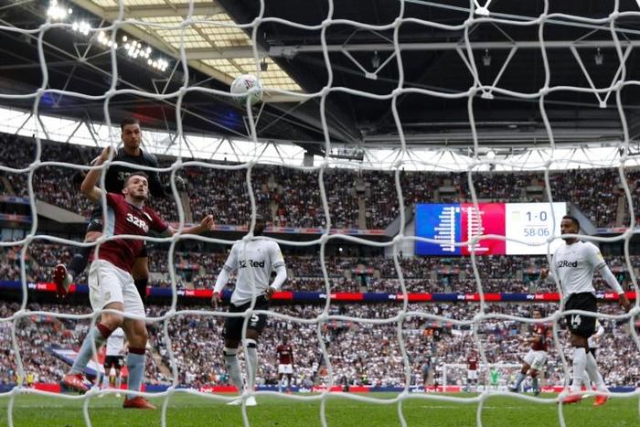 Golden goal -- Aston Villa's John McGinn heads the ball past Derby goalkeeper Kelle Roos to score his side's second in a 2-1 Championship playoff final win
