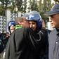 An Algerian lawyer kisses a policeman during a protest against ailing President Bouteflika's bid for a fifth term in power, in Algiers on Thursday