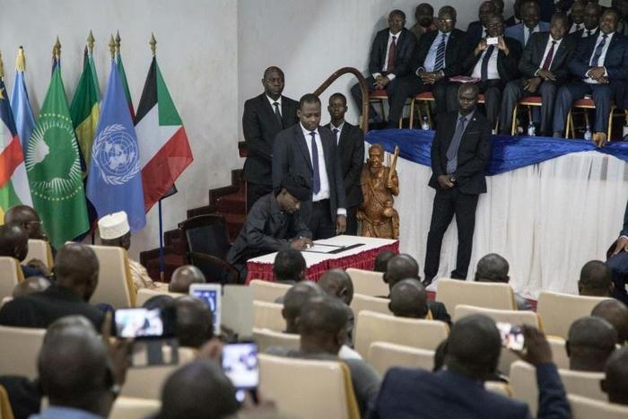 Sidiki Abbas, leader of the 3R armed group claiming to defend the Fulani people, signs the so-called Khartoum Agreement on Wednesday