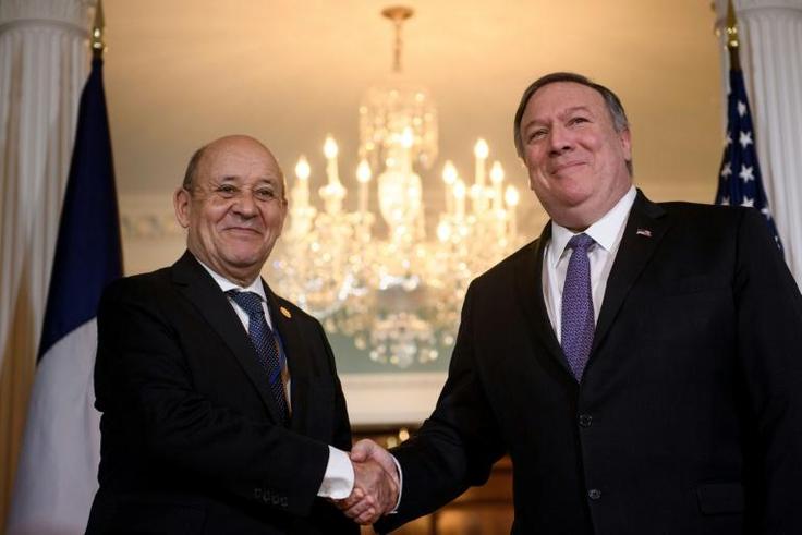 US Secretary of State Mike Pompeo (right) raises objections to France's plans to tax digital giants in a meeting in Washington with Foreign Minister Jean-Yves Le Drian