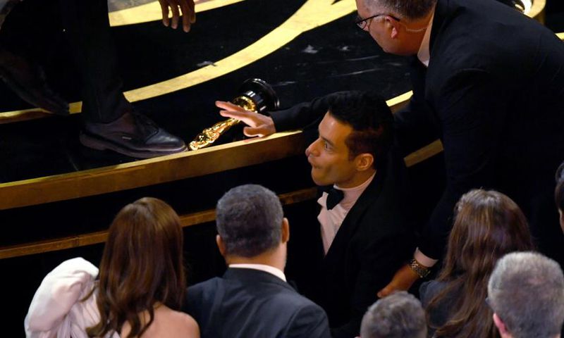 Rami Malek Falls Off Stage After Oscars Speech