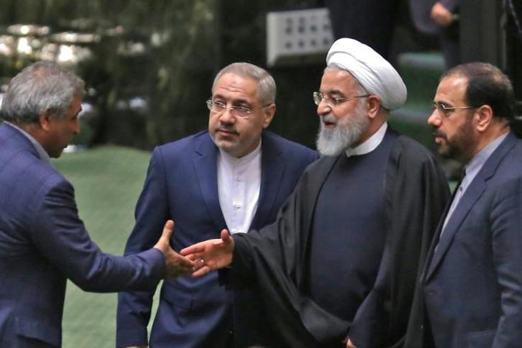 Iranian lawmakers greet President Hassan Rouhani (2nd-R) in the capital Tehran on February 4, 2019.