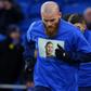 Cardiff players warm up in T-shirts bearing the image of missing Argentine footballer Emiliano Sala